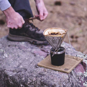 The BruTrek Pour Over Coffee Maker's  flat pack design expands to fit over any cup, mug, vessel of opportunity.